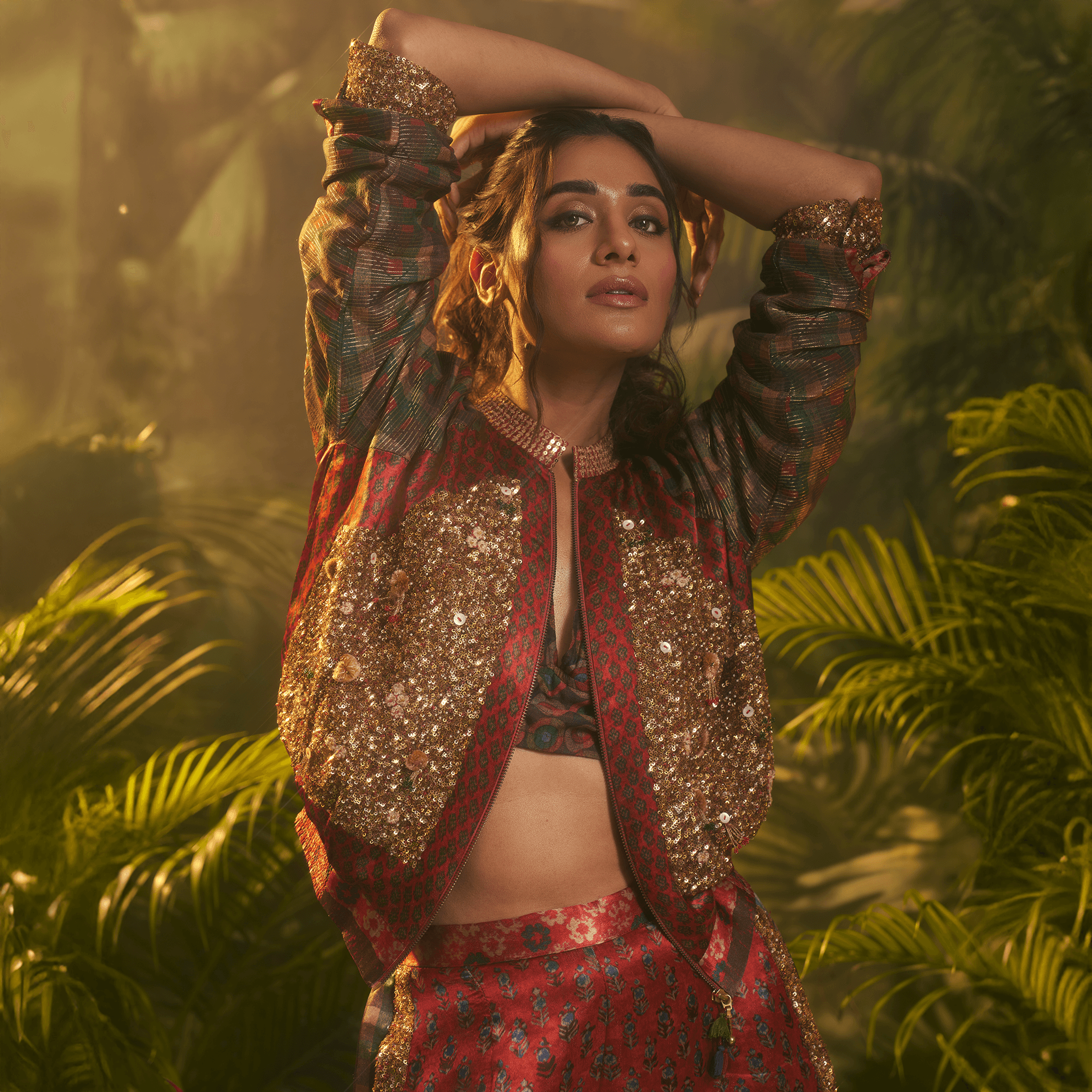 Timeless bridal fashion trends 2026 featuring a red embellished bomber jacket and skirt set in silk