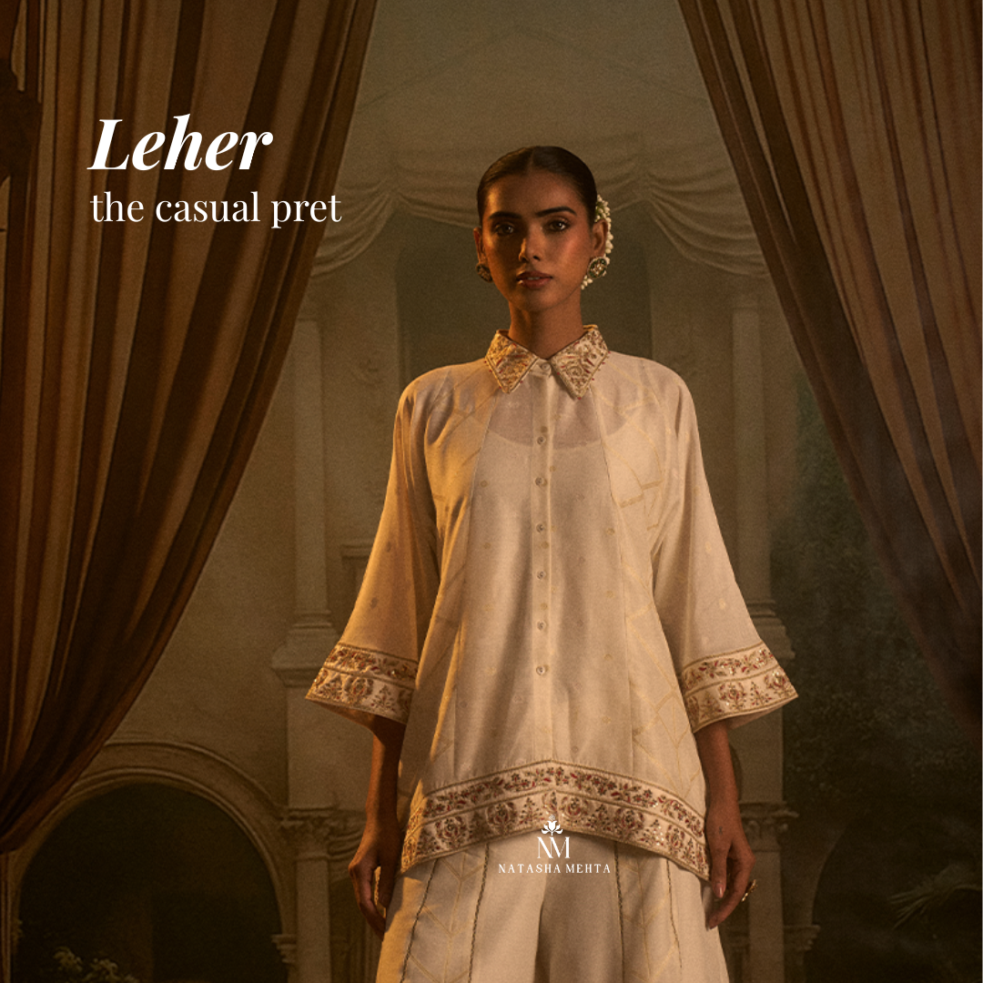 Yellow luxury fusion kurti Dubai with intricate embroidery, perfect for festive occasions, paired with navy trousers