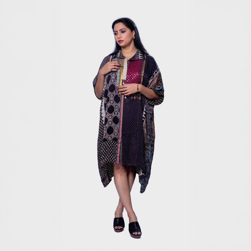 Woman wearing ajrakh mosaic cape kaftan with geometric and floral patterns by Natasha Mehta