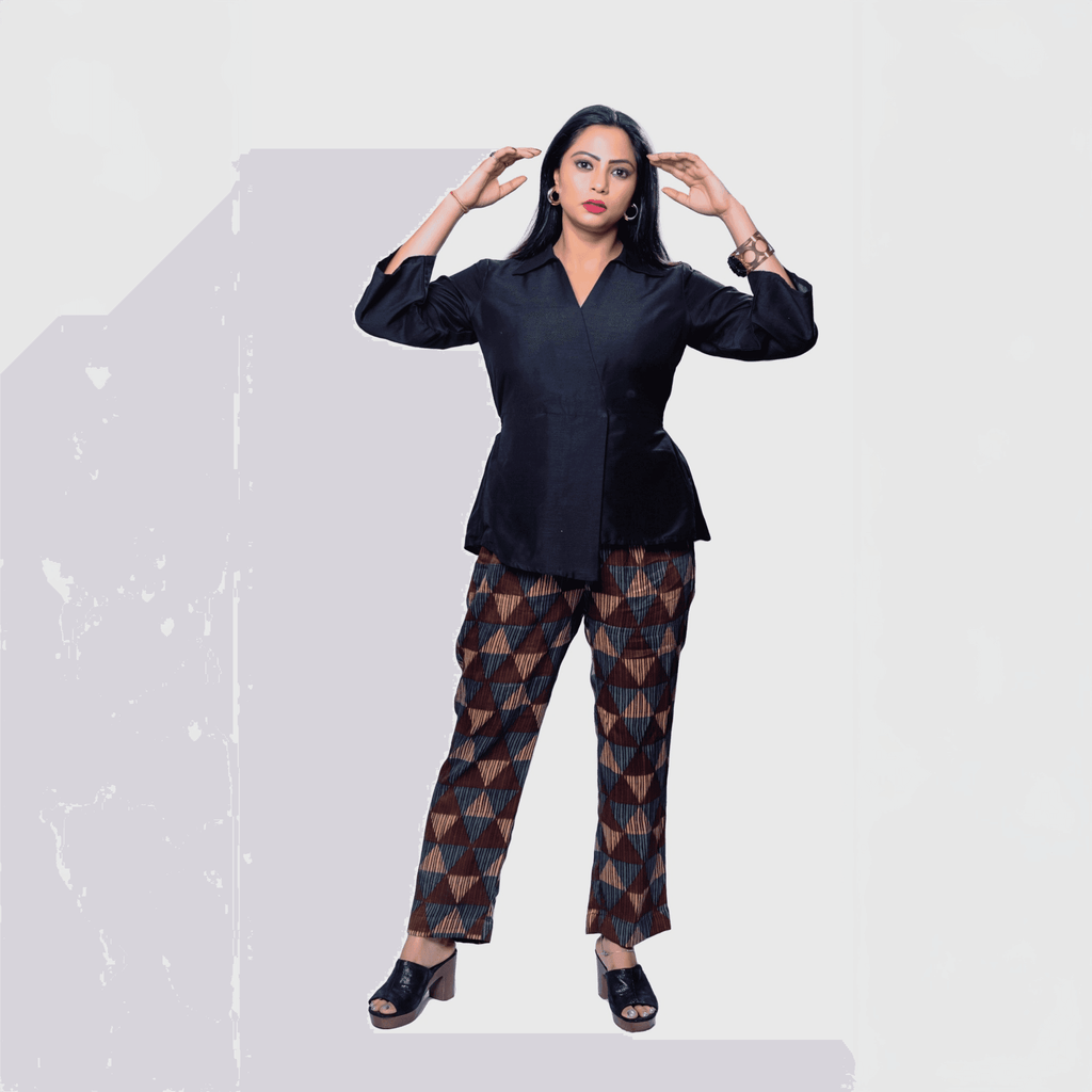 Stylish black collared top and pants set featuring geometric patterns, perfect for Dubai events