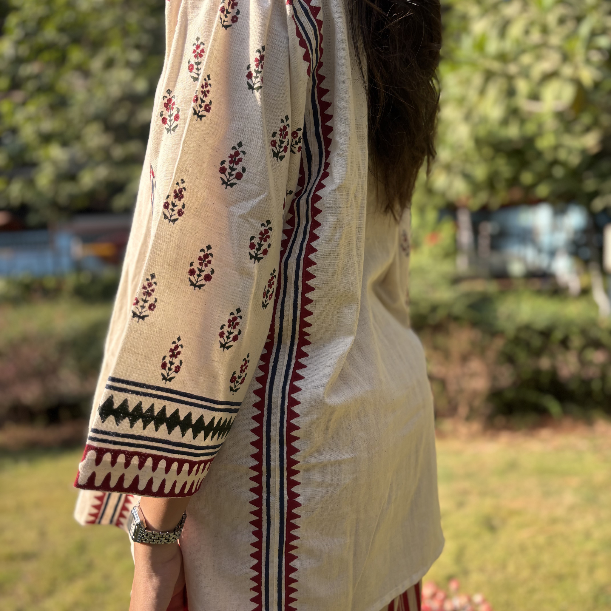 Elegant floral kurta set by Natasha Mehta with block print prints in cream, perfect for casual outings or Dubai events