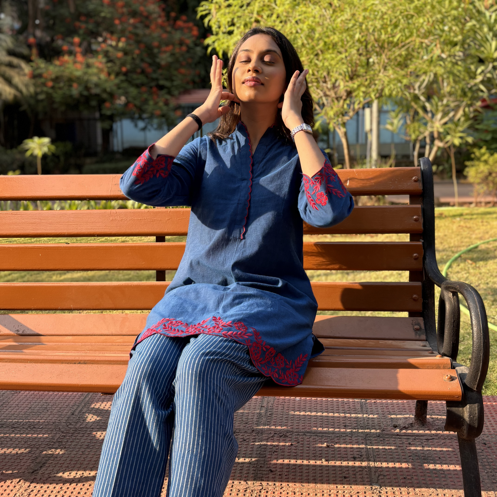 Elegant floral kurta set in denim blue with red embroidery, perfect for casual outings or Dubai gatherings