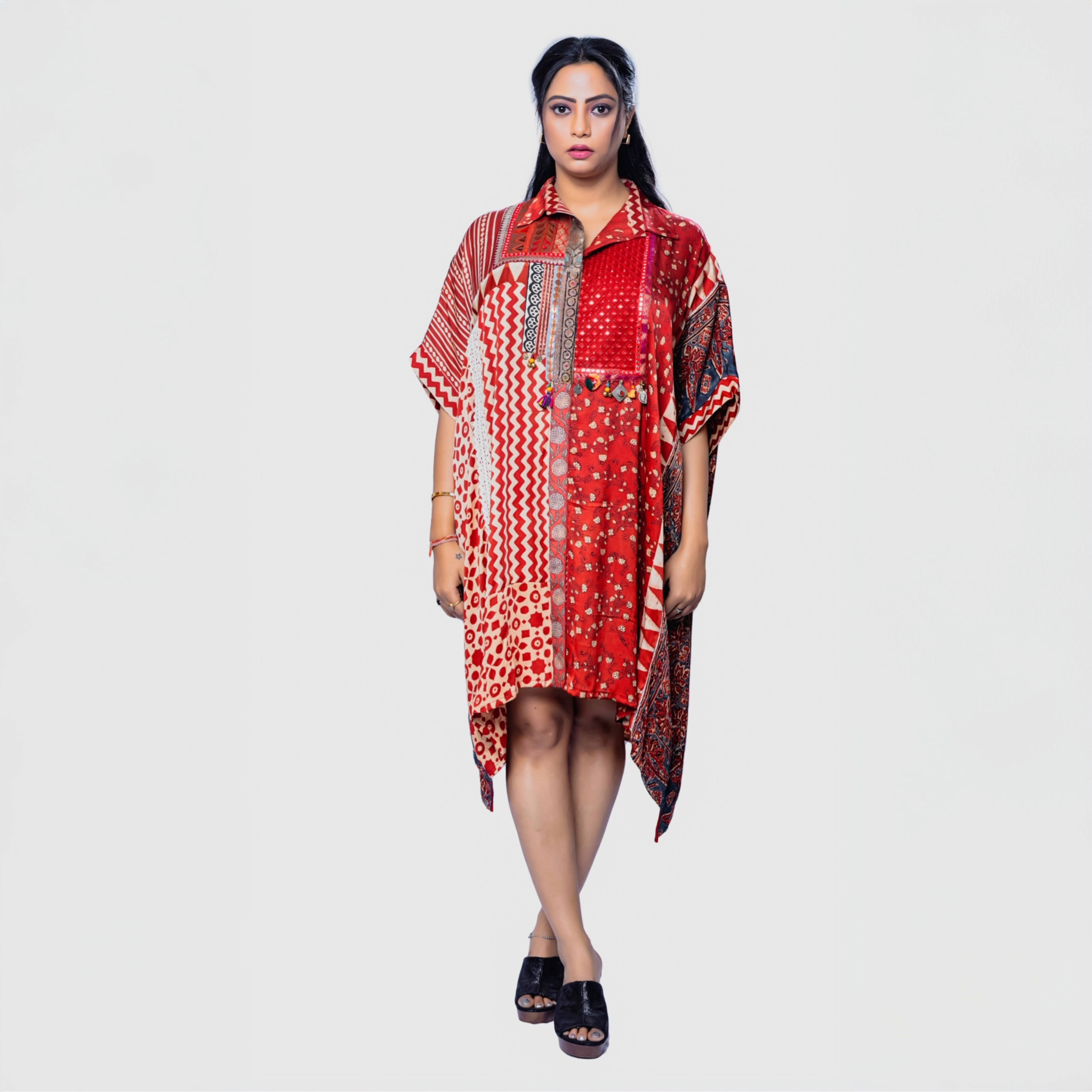 Woman wearing a colorful red patterned bohemian chic kaftan outfit with short sleeves from My Store