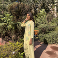 Elegant butter yellow dress set with floral embroidery, perfect for casual outings or Dubai events