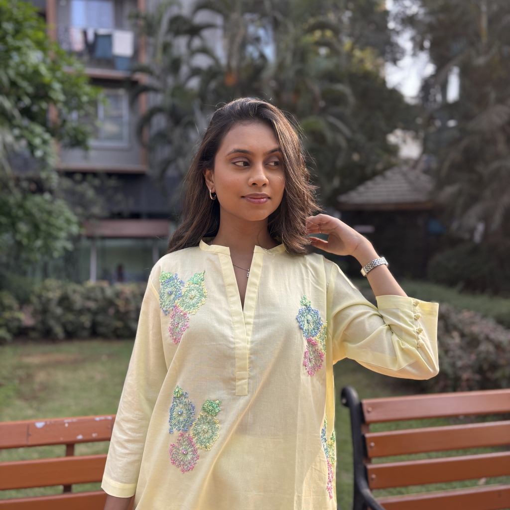 Butter yellow dresses featuring floral embroidery and a relaxed fit, perfect for casual outings in Dubai