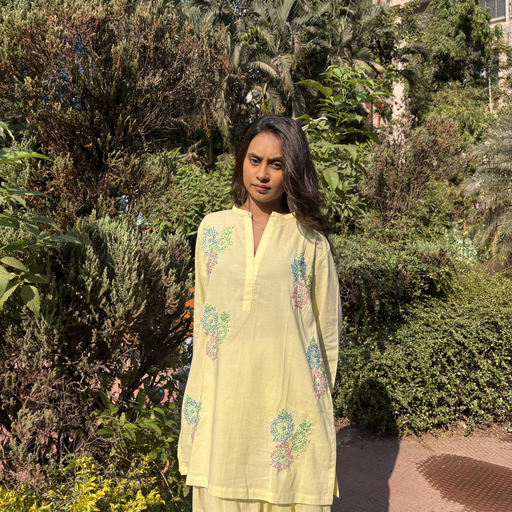 Butter yellow dress with floral embroidery, perfect for casual outings or events in Dubai