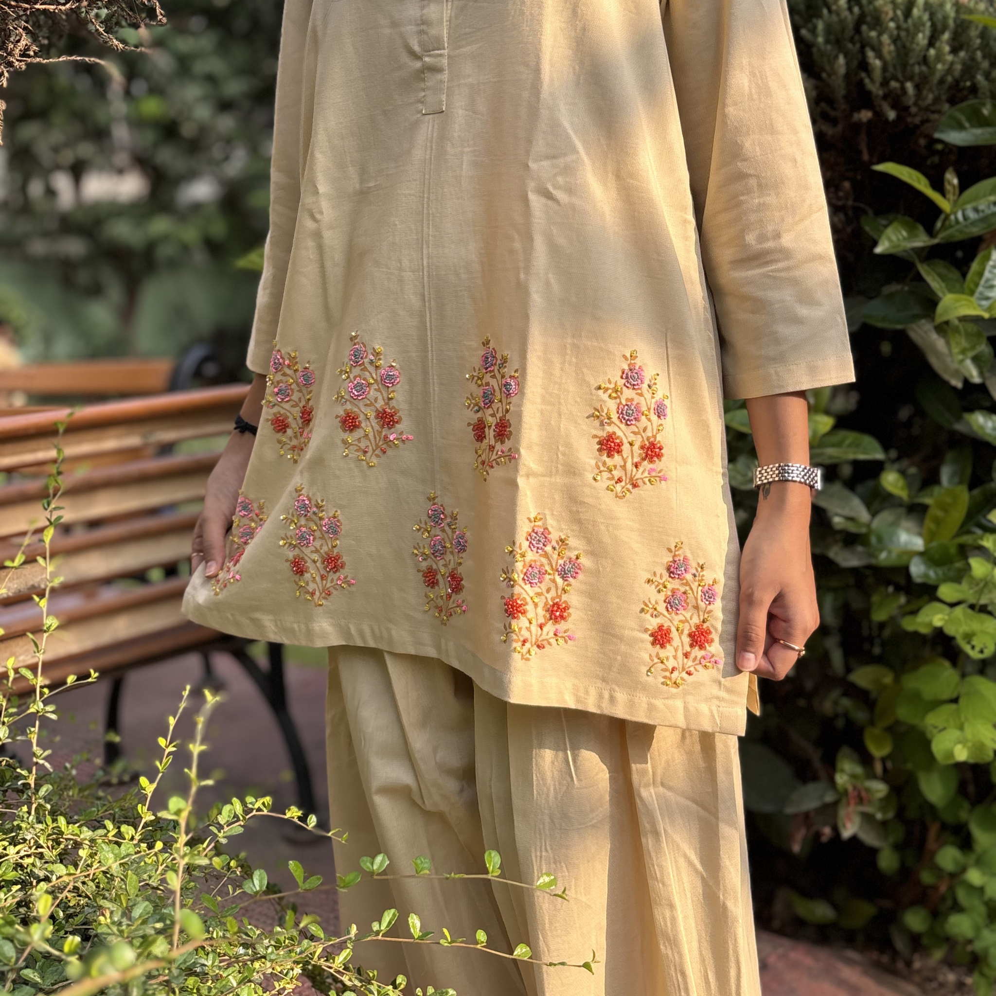Embroidered pajamas set in soft cream color with floral patterns, ideal for casual wear or Dubai evenings.
