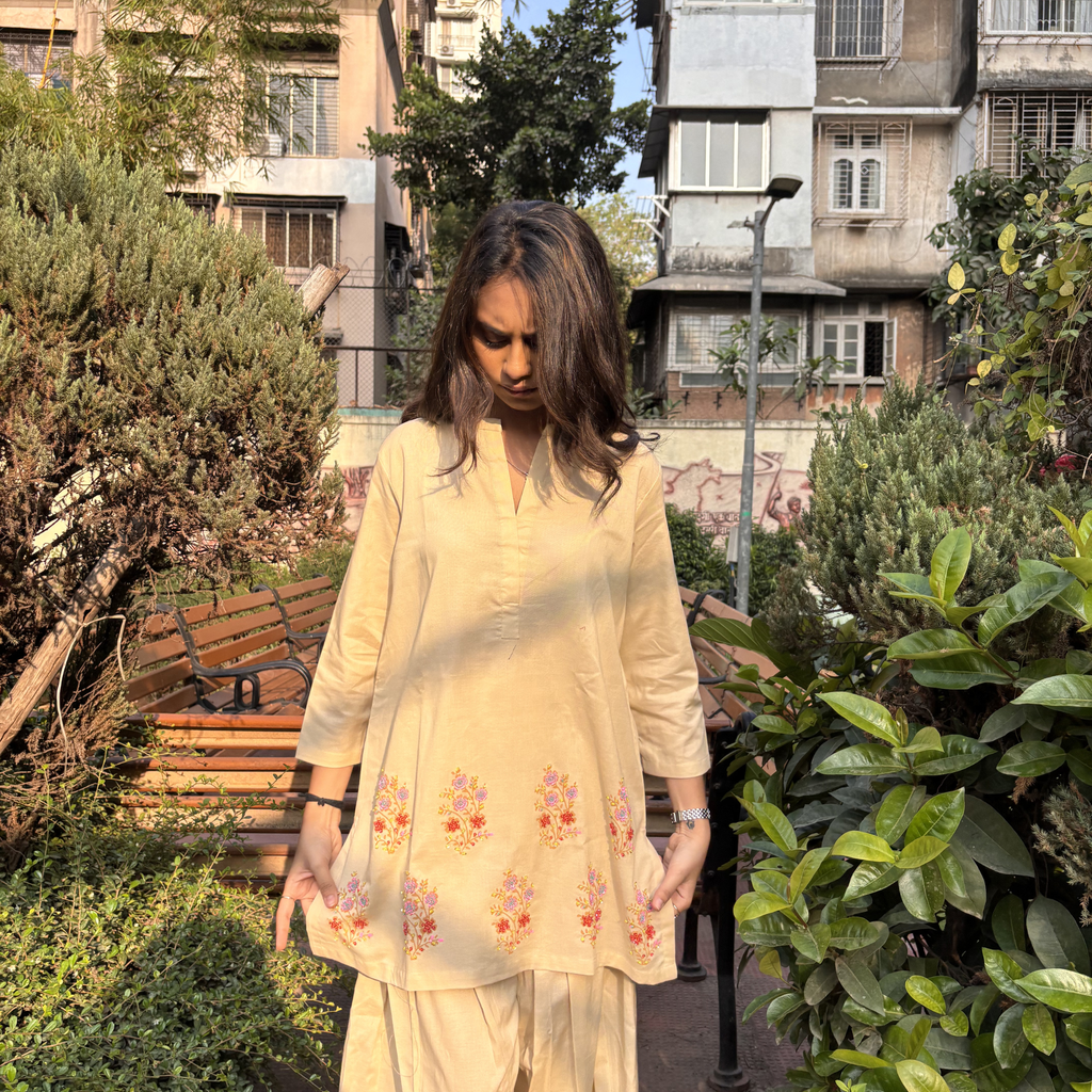 Elegant embroidered pajamas set featuring floral patterns in soft yellow, ideal for casual outings or lounging in Dubai