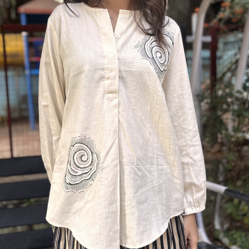 Stylish cream blouse by Natasha Mehta with black spiral embroidery, suitable for casual wear at great sand dune national park