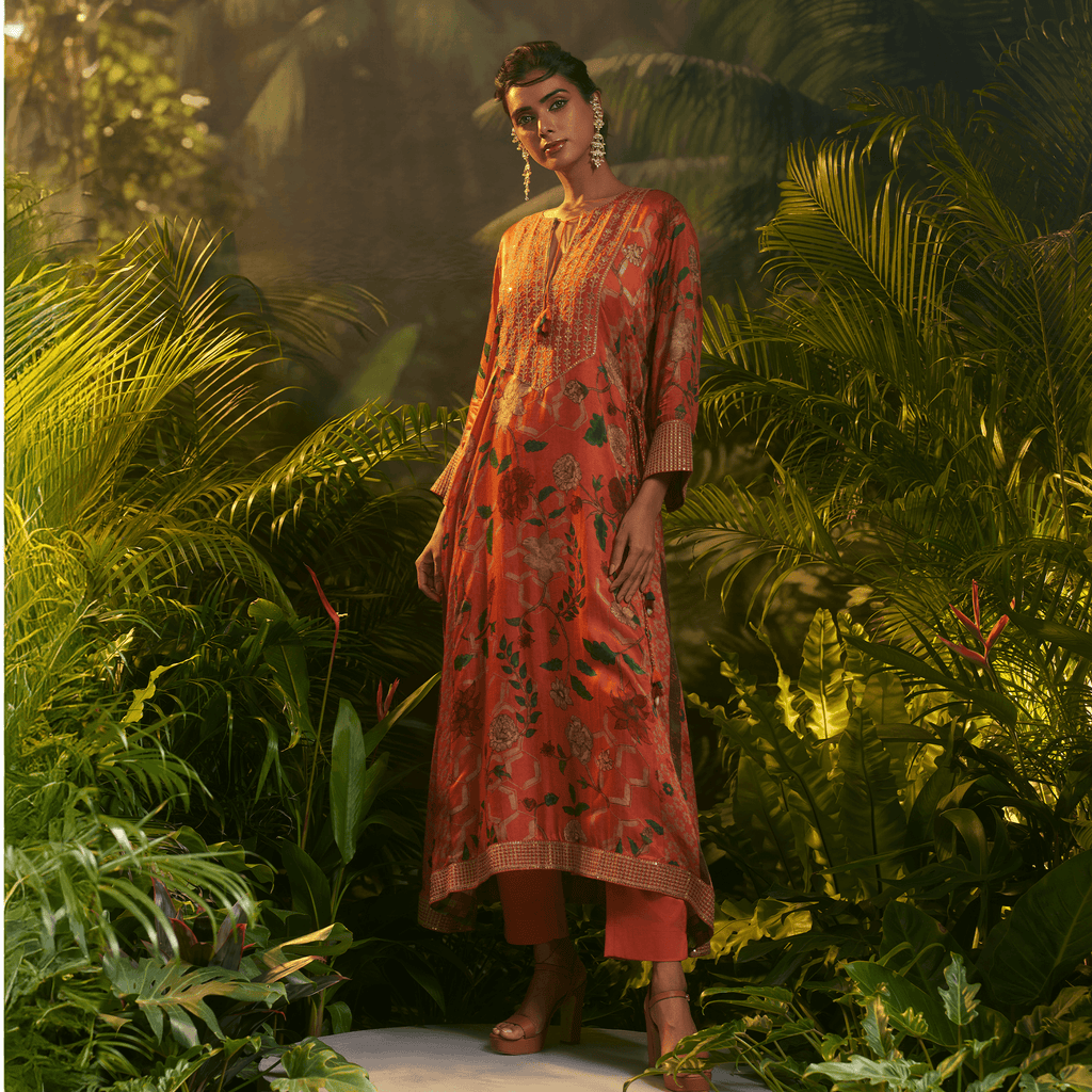 Elegant orange printed kurta for special occasions featuring floral designs and a relaxed fit
