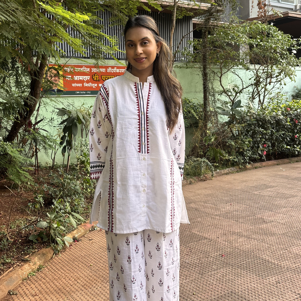 Elegant white cocktail outfit featuring intricate embroidery, perfect for outdoor gatherings or events in Dubai