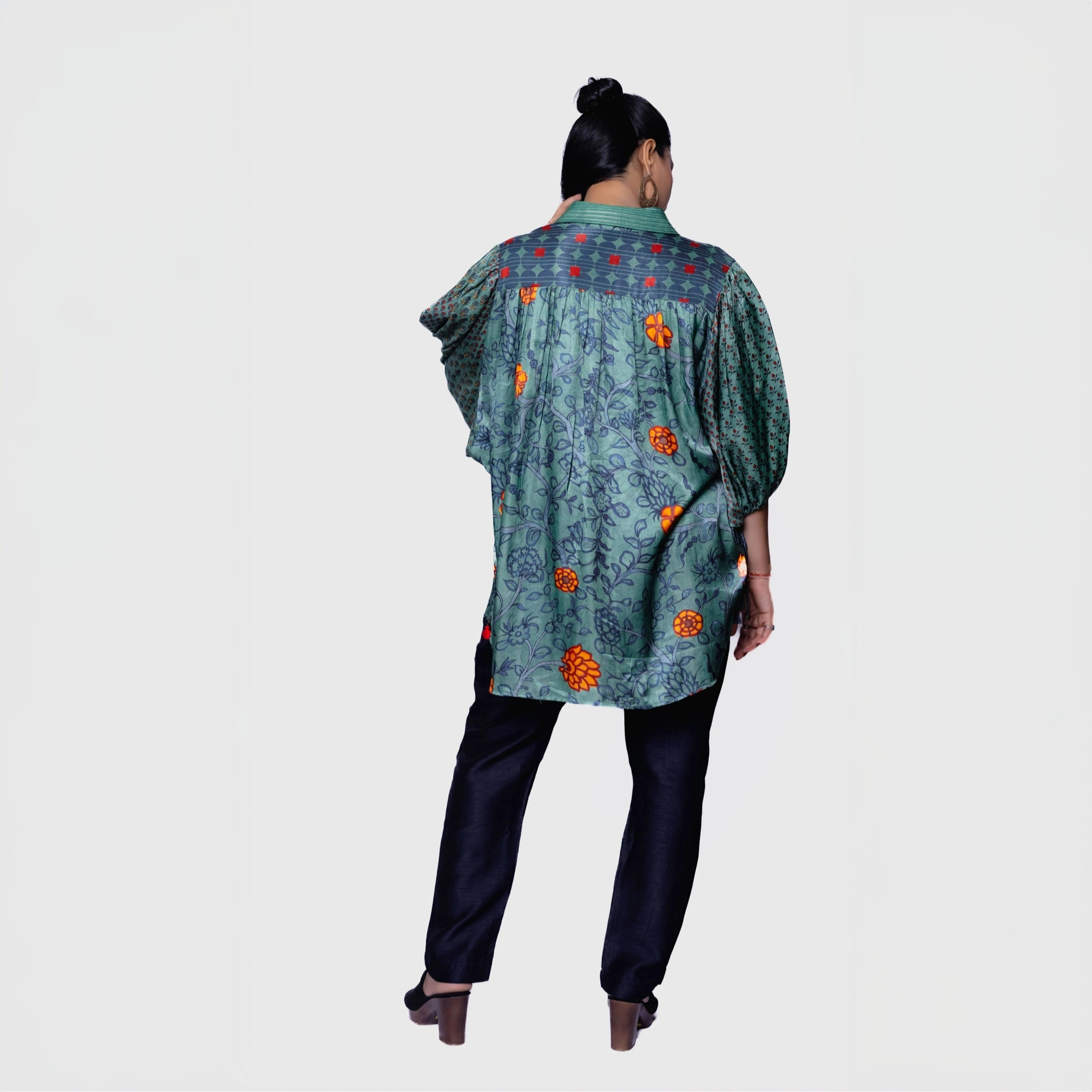 Back view of designer collared kurta for women with floral print and puff sleeves