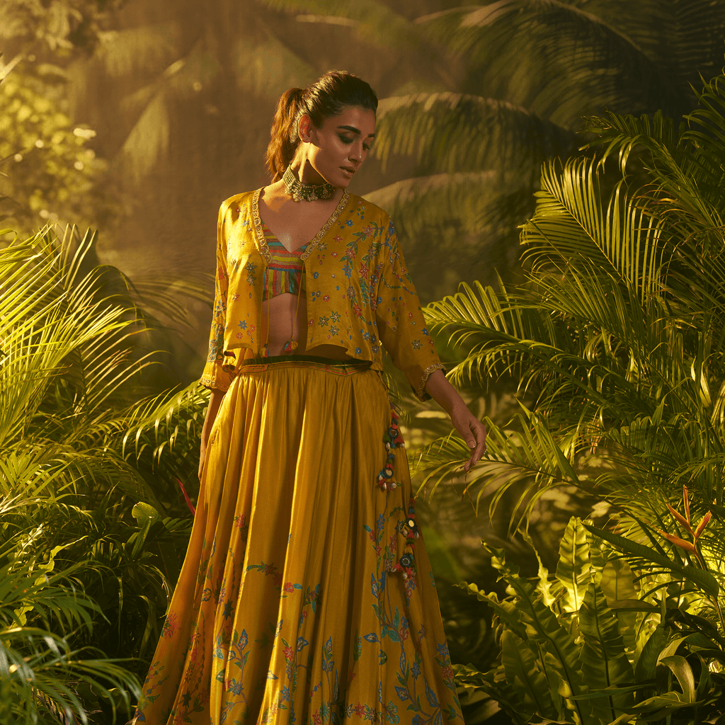 Elegant designer ghaghra choli with jacket in yellow featuring intricate floral embroidery
