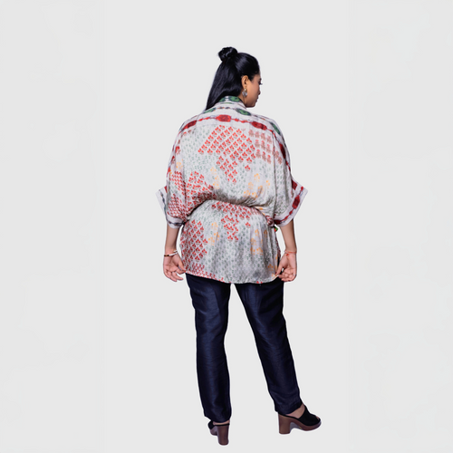 Elegant beige designer kaftan top for women with red and orange floral patterns, ideal for casual outings or Dubai.