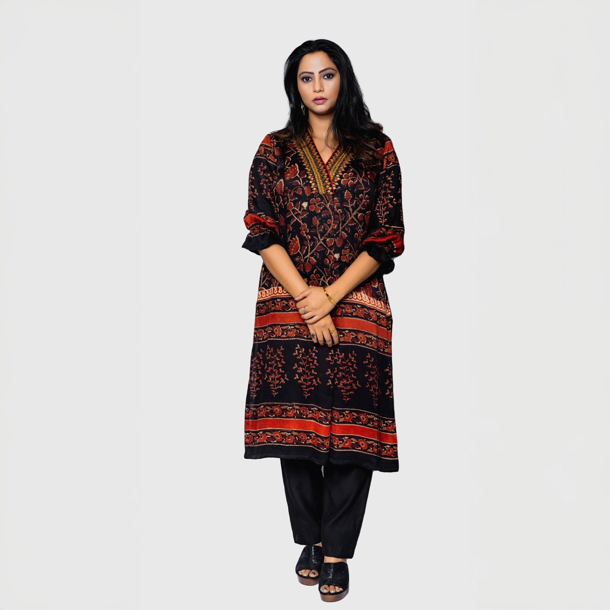 Elegant designer rust kurta for women with intricate floral patterns and black pants
