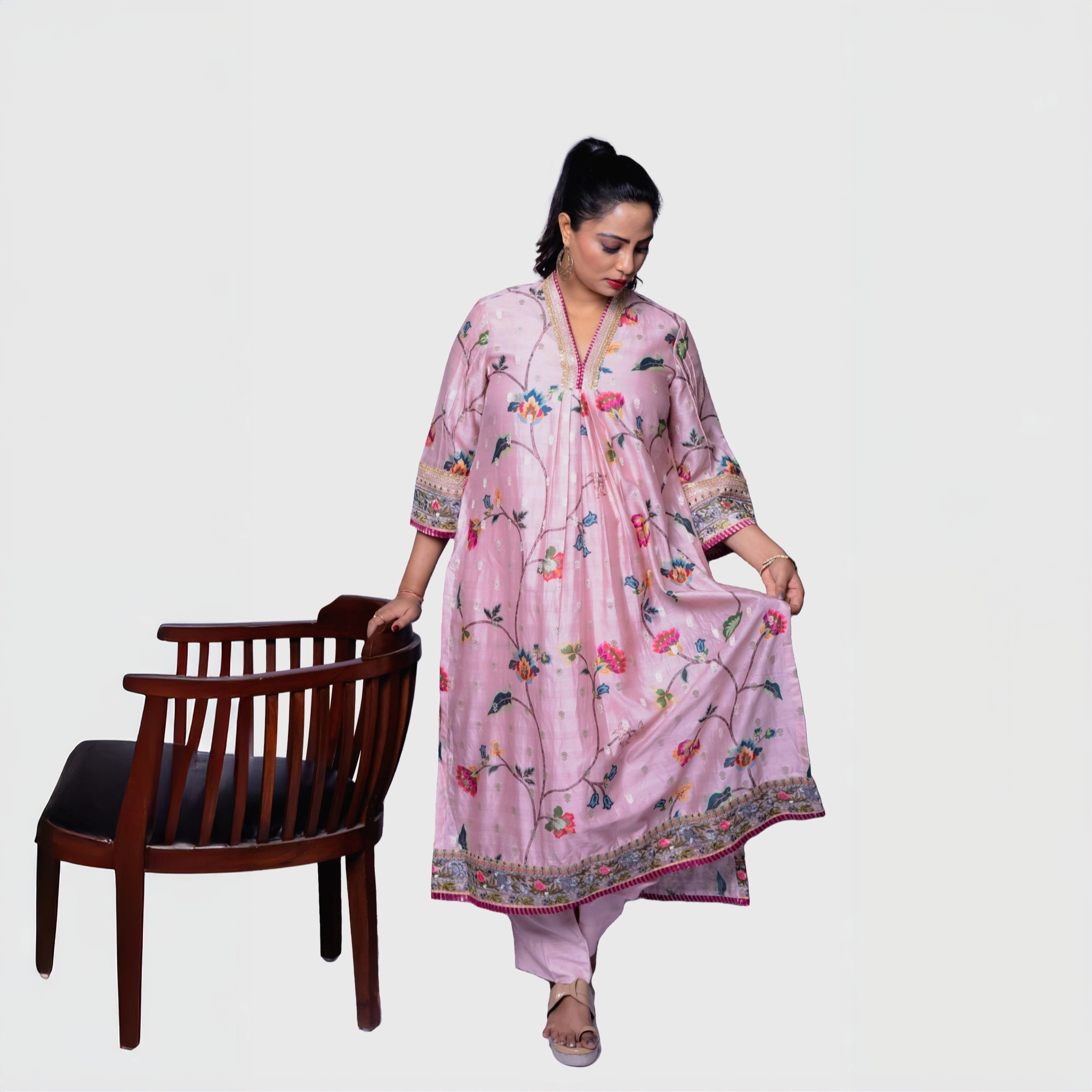 Pink embroidered salwar kameez set with multicolor floral print worn by model luxury floral ethnic wear