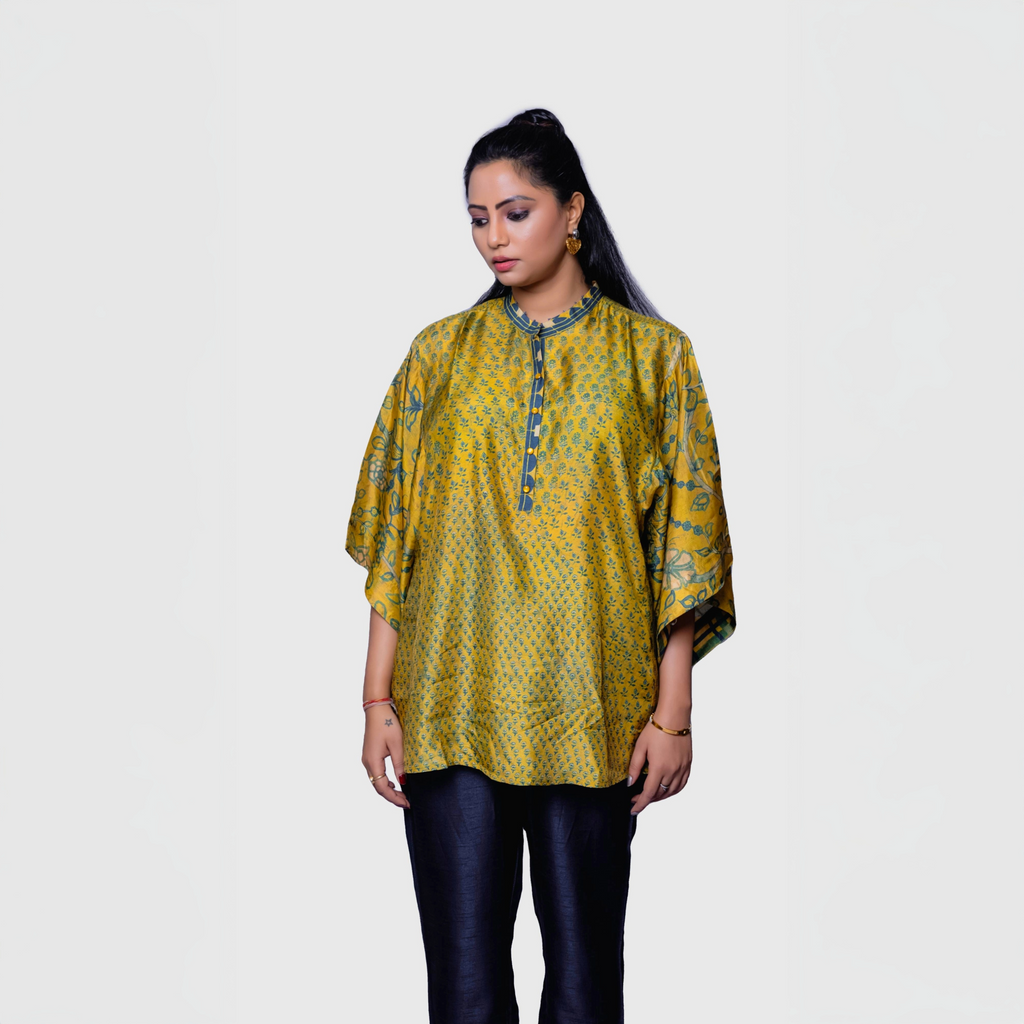 Woman wearing fusion fashion Ajrakh shirt kaftan style one pcs dress in yellow and blue patterns