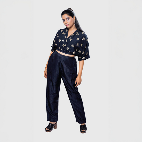 Woman wearing handcrafted black co-ord outfit with embroidery black top and matching pants