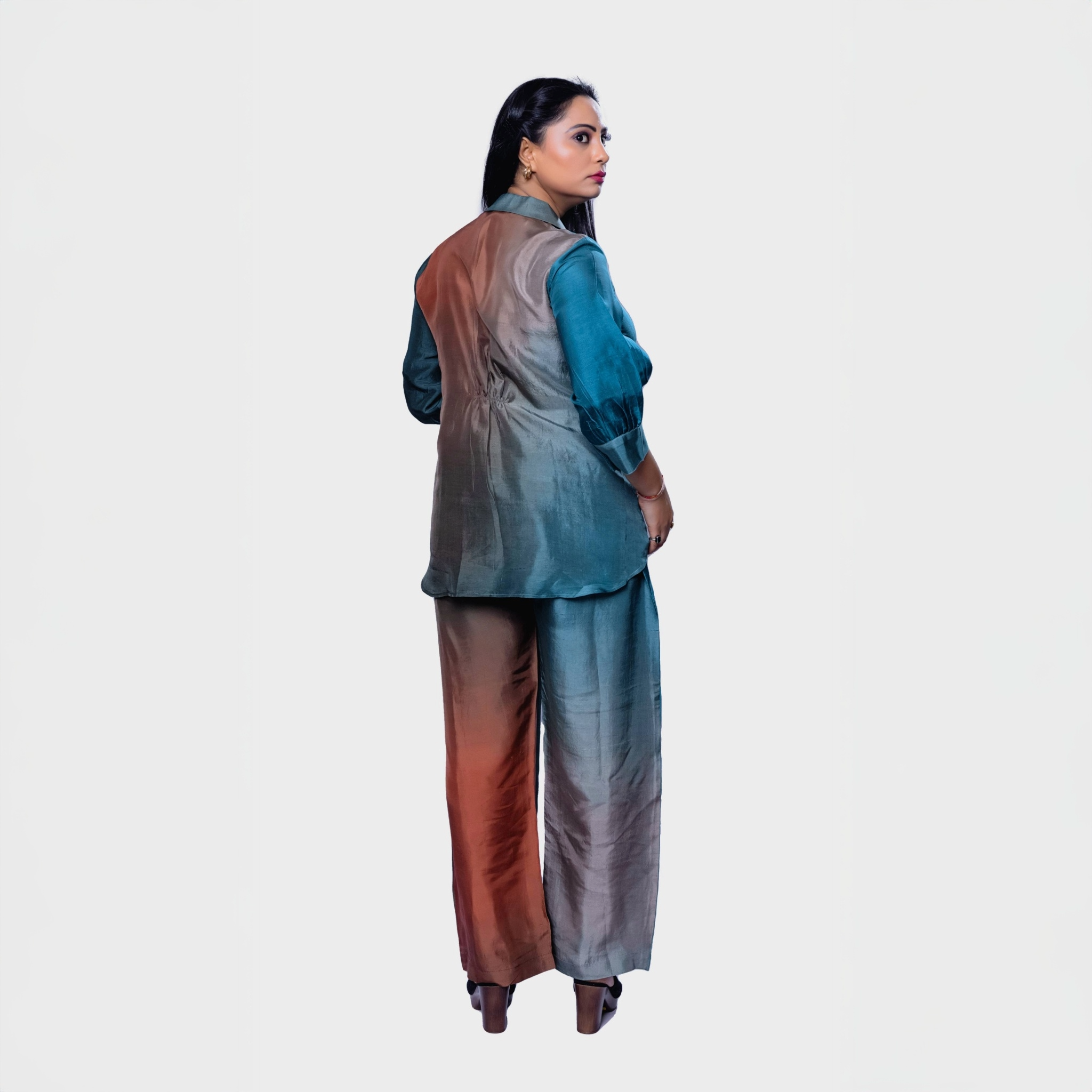 Handcrafted designer clothing for women, featuring a shaded blue and brown set, perfect for Dubai occasions.