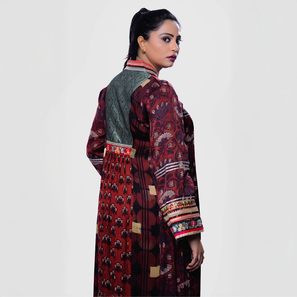 Elegant Salwar and Khameez featuring intricate patterns, showcasing a handcrafted phulkari charm set.