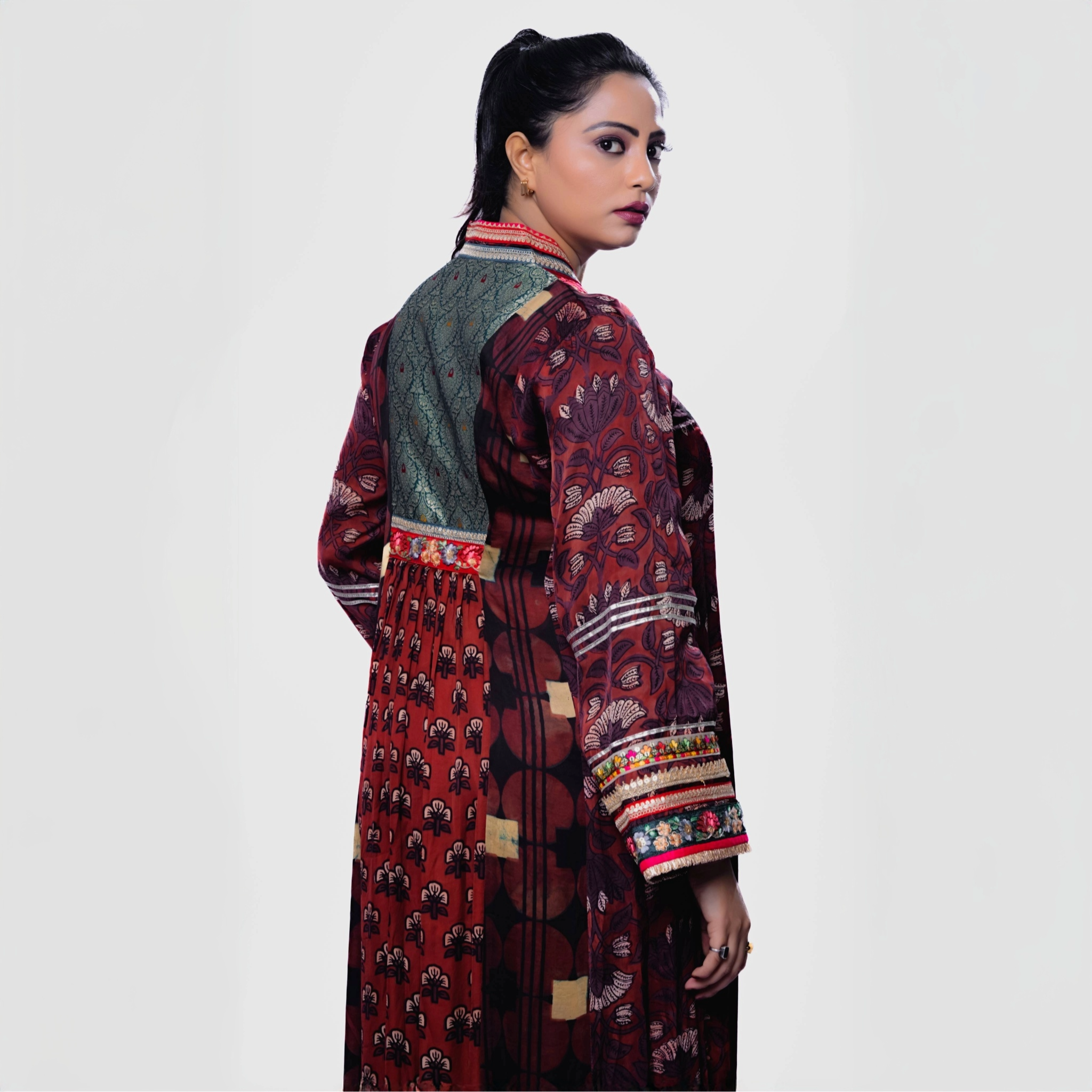 Elegant Salwar and Khameez featuring intricate patterns, showcasing a handcrafted phulkari charm set.