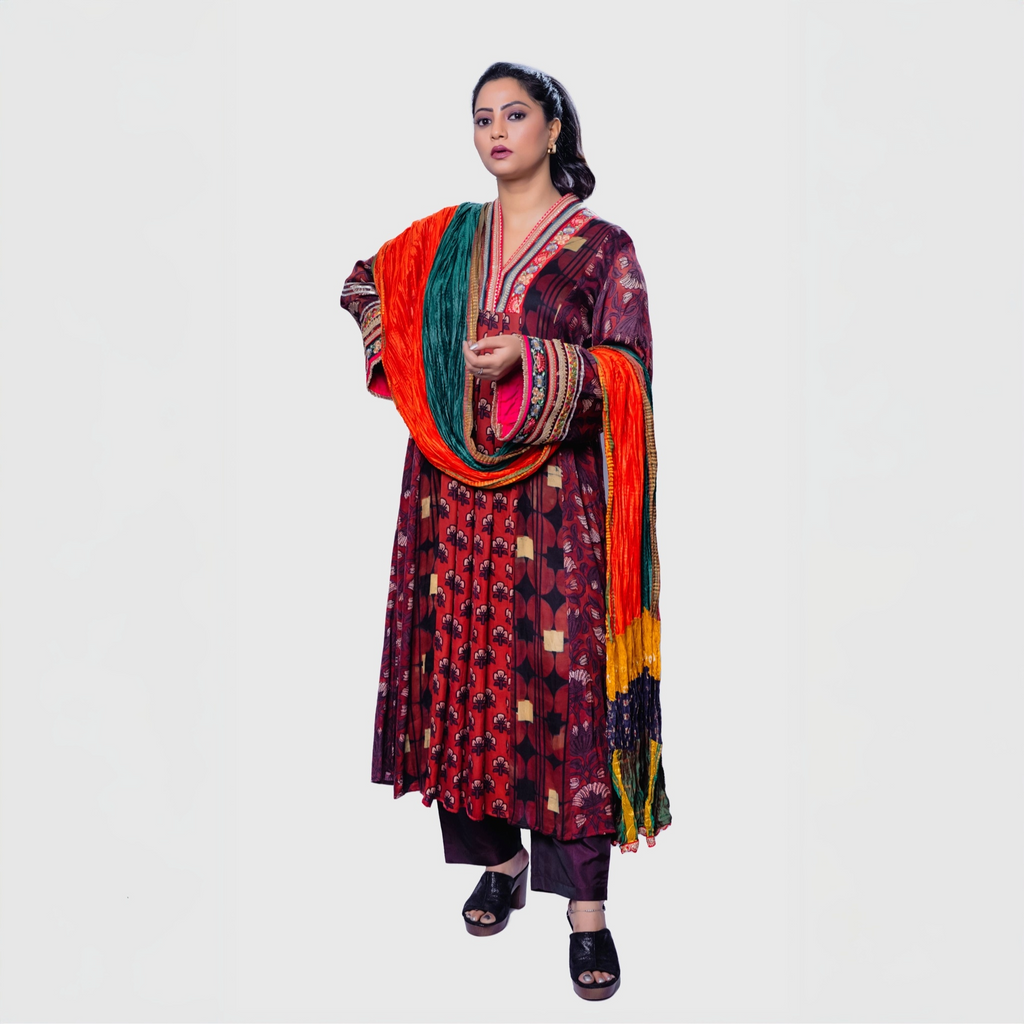 Colorful handcrafted phulkari charm set salwar and khameez featuring vibrant patterns, ideal for festive occasions