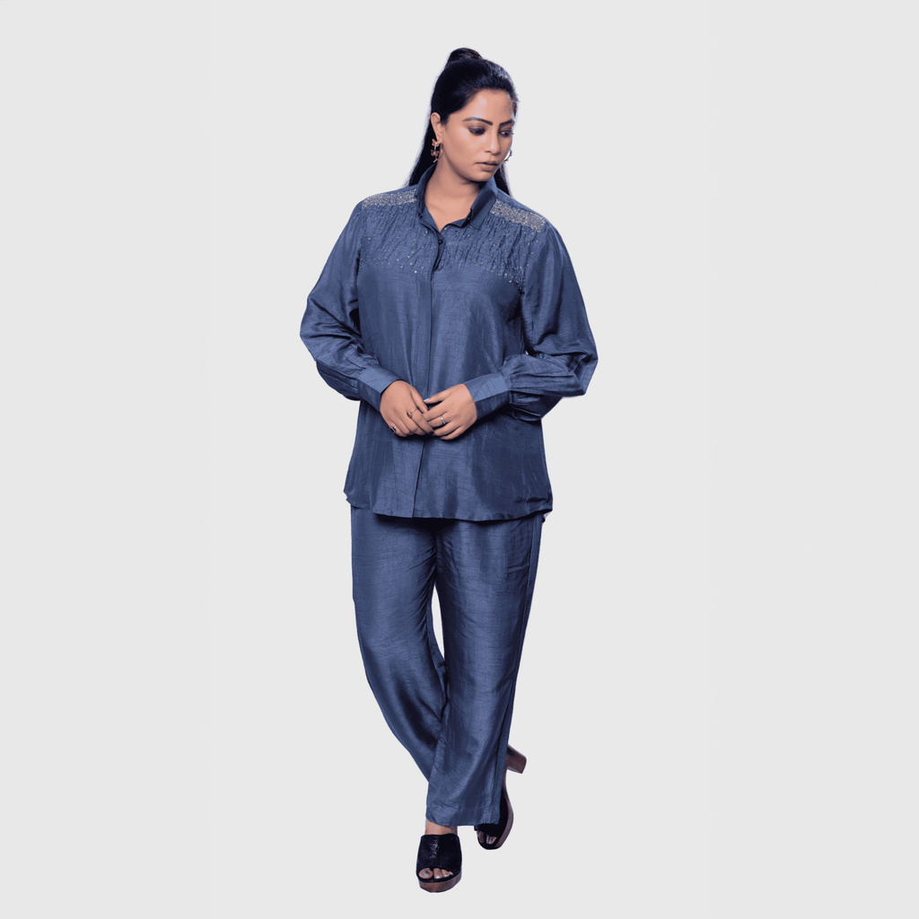 Luxury two-piece party set in blue featuring a stylish shirt and matching pants for elegant occasions