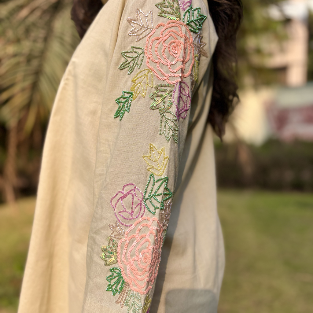 Beige embroidered tunic with floral pattern and pastel colors, perfect for a casual outing or Dubai occasion, part of a matching set women's.