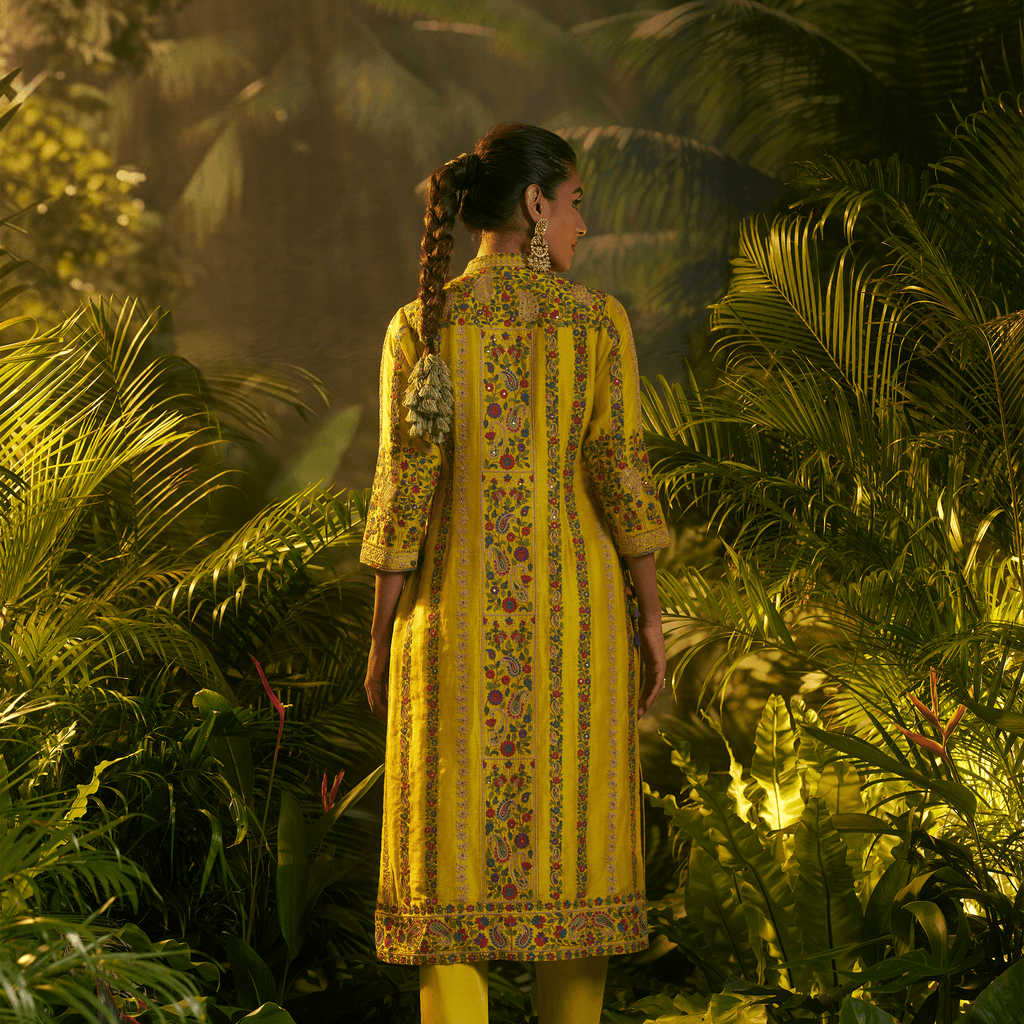 Mustard yellow embroidered kurta set with floral patterns and a traditional design for a festive look