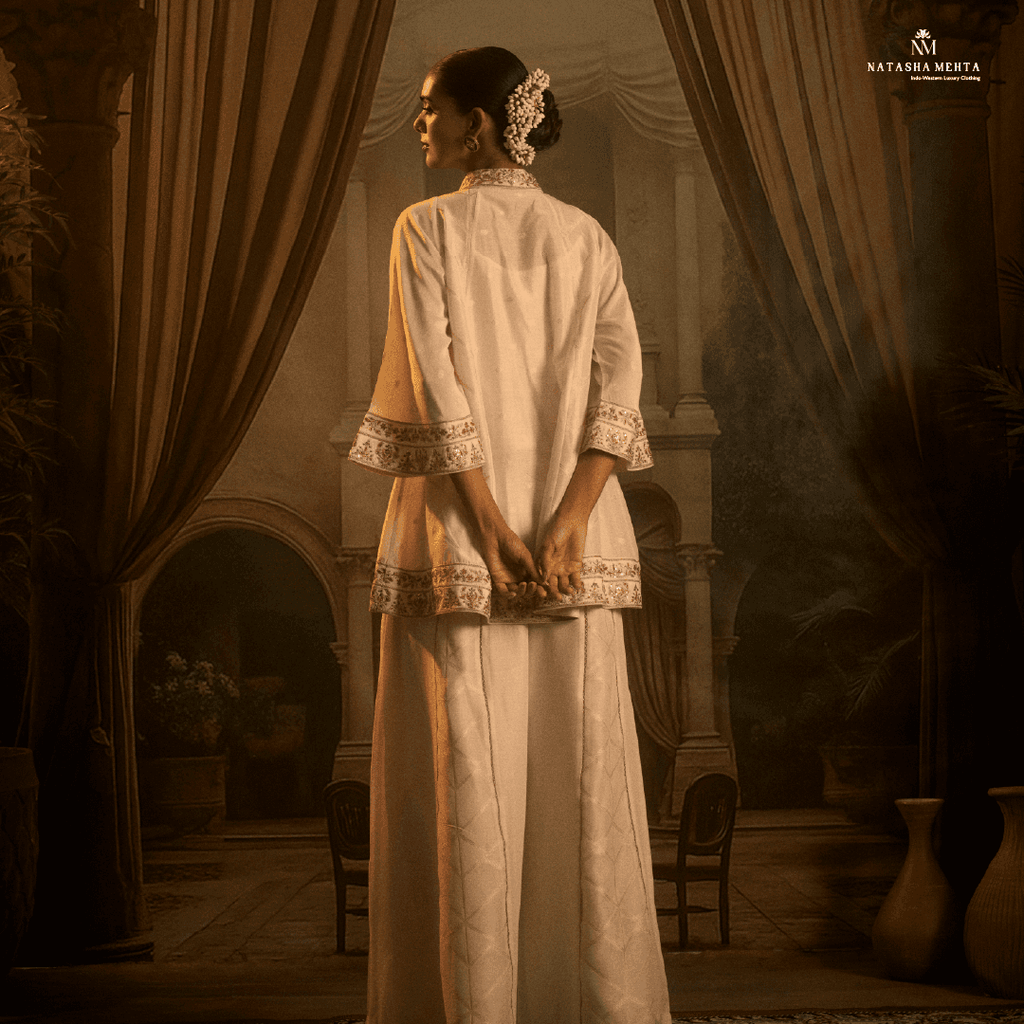 My Store Designer Eid Celebration Attire in White with Embroidered Details and Flowing Fabric