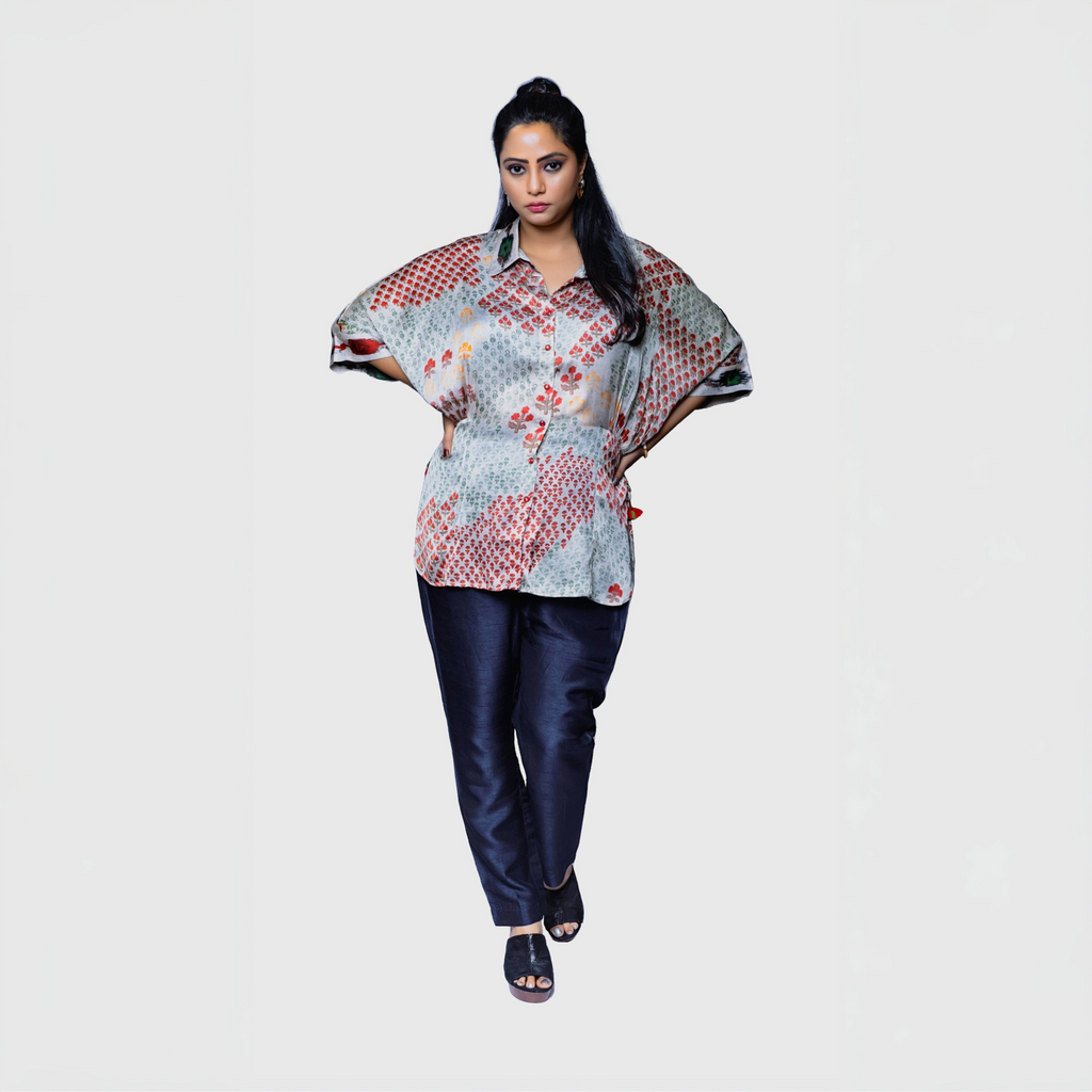 Model wearing patterned designer kaftan top for women paired with navy pants on white background by My Store