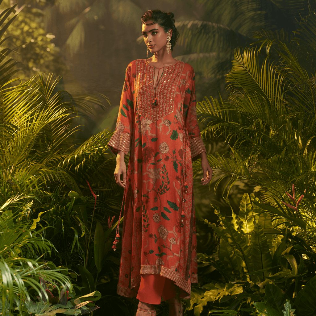 Elegant orange printed kurta for special occasions with intricate floral designs and traditional neckline