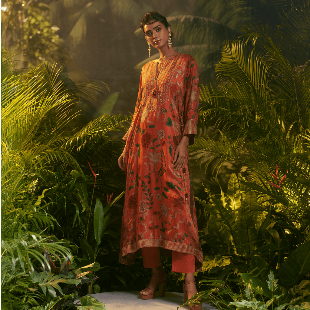 Elegant orange printed kurta for special occasions featuring floral designs and a relaxed fit