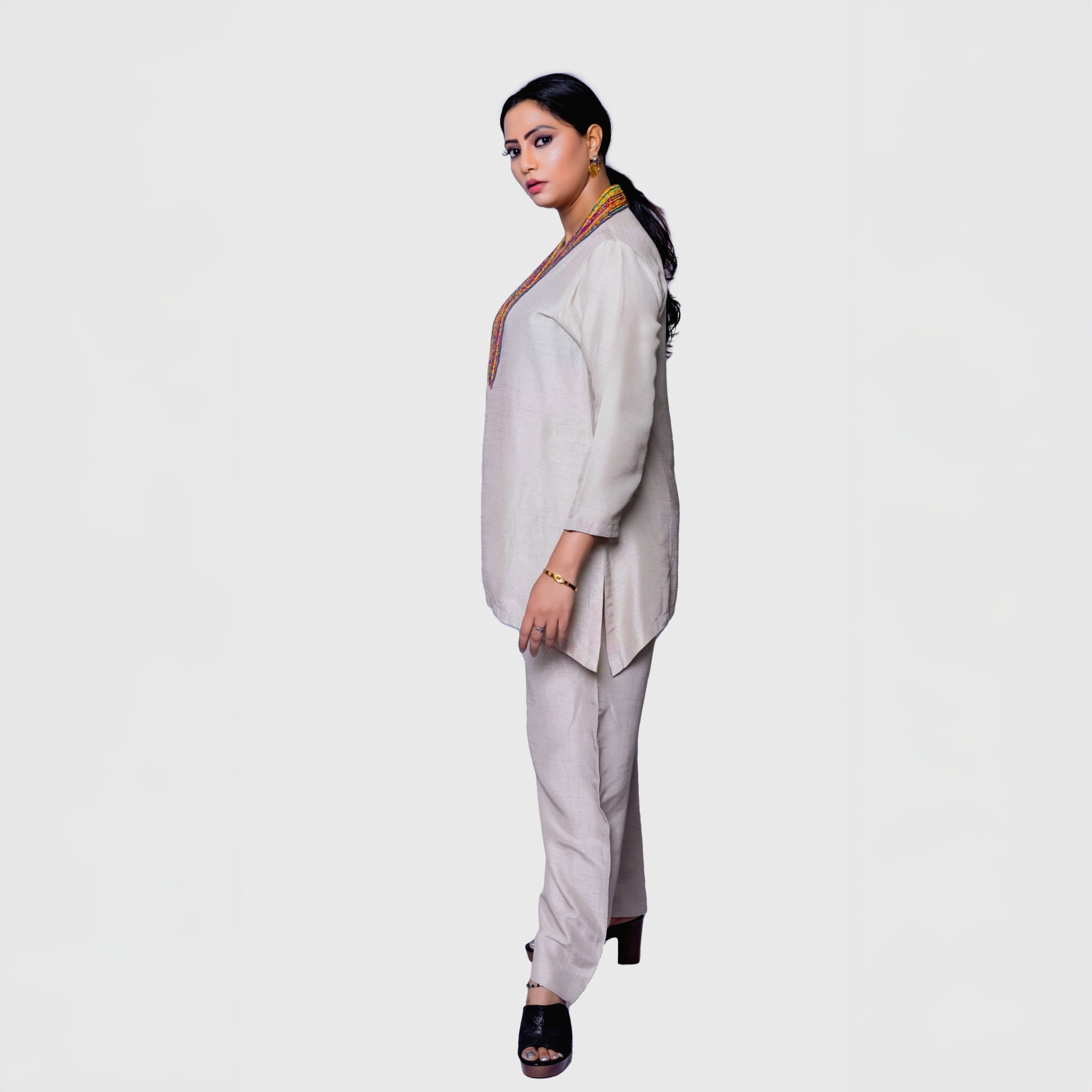 Pearl white kurta set with colorful yoke for women, featuring a stylish and modern design