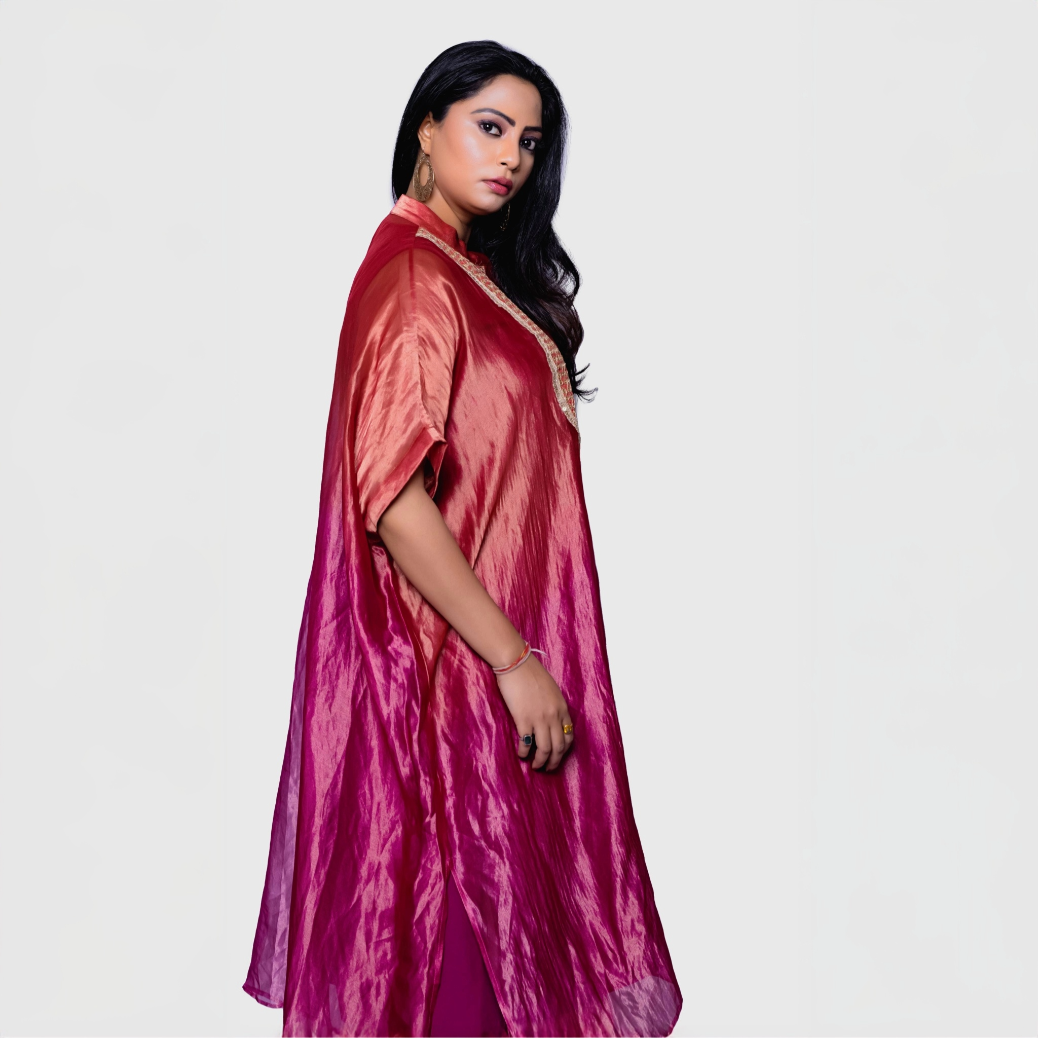 Elegant silk fusion evening gown in rich shades of red and pink for a sophisticated look