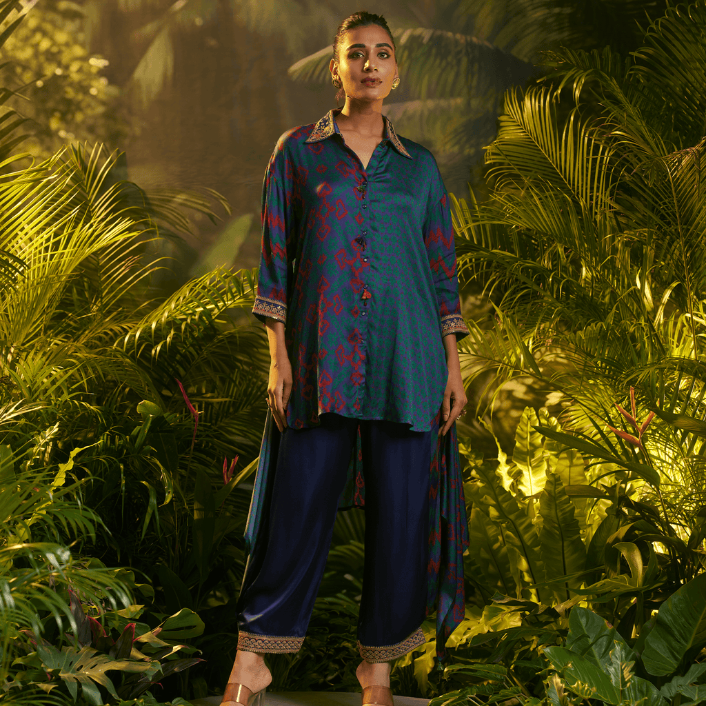 Teal and navy kurta set with intricate patterns, perfect for festive occasions