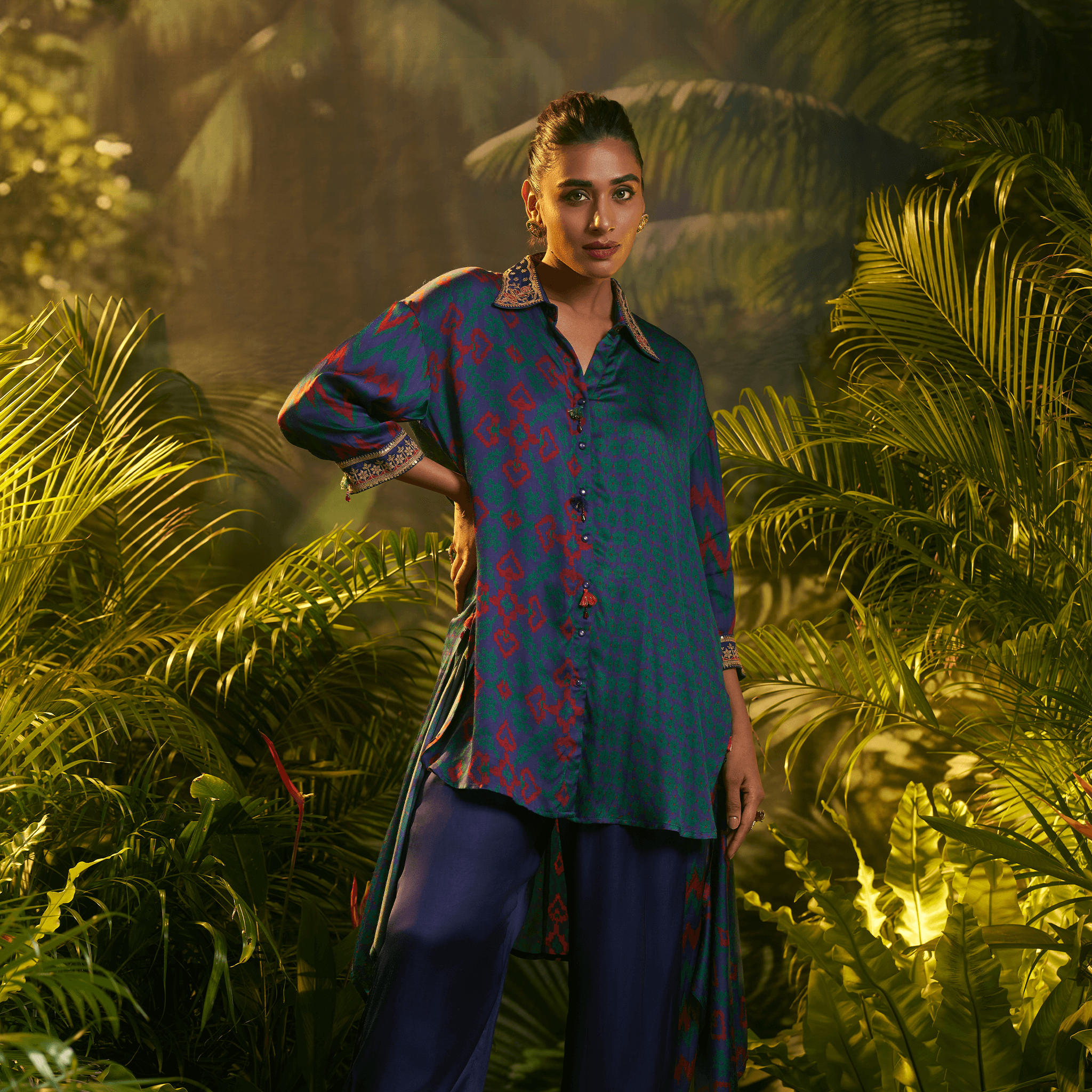 Elegant teal and navy kurta set styled with unique patterns for a fashionable look