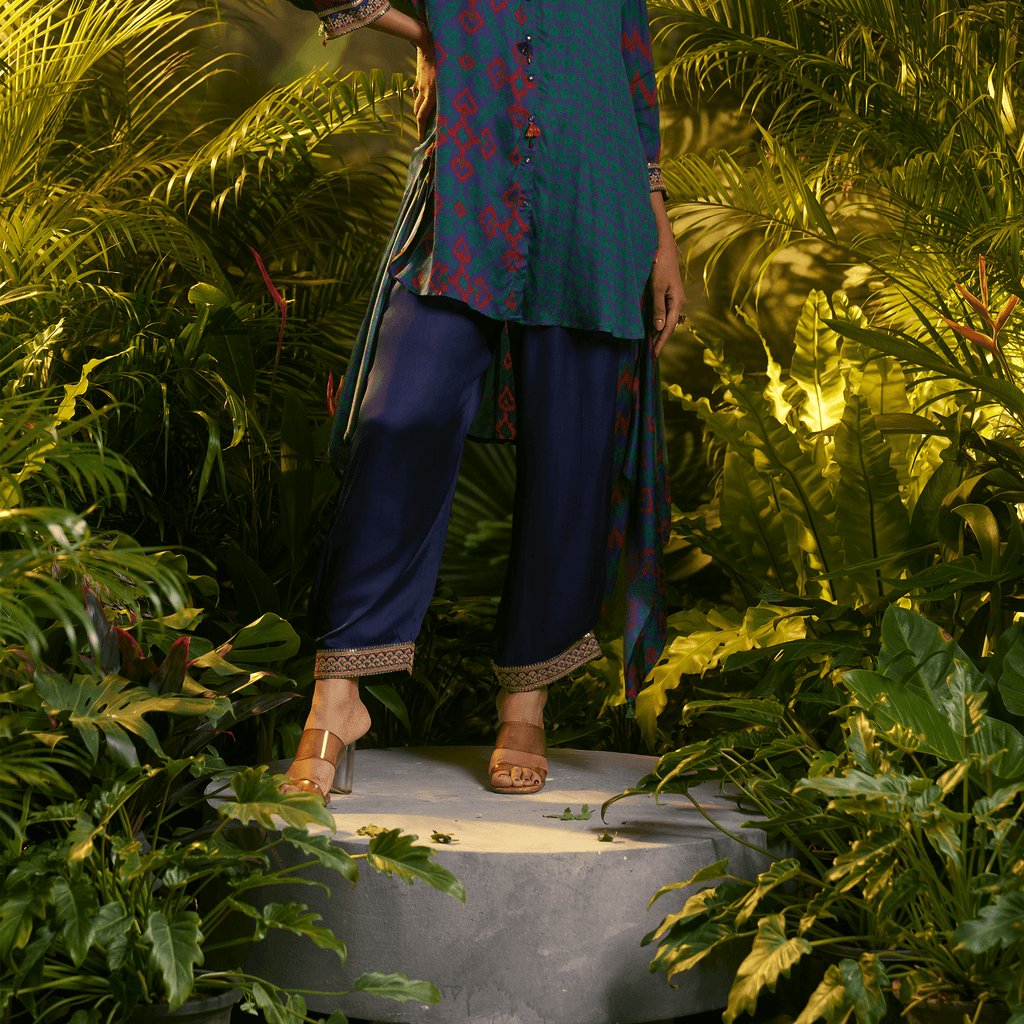 Elegant teal and navy kurta set featuring intricate designs and comfortable loose fit, perfect for festive occasions