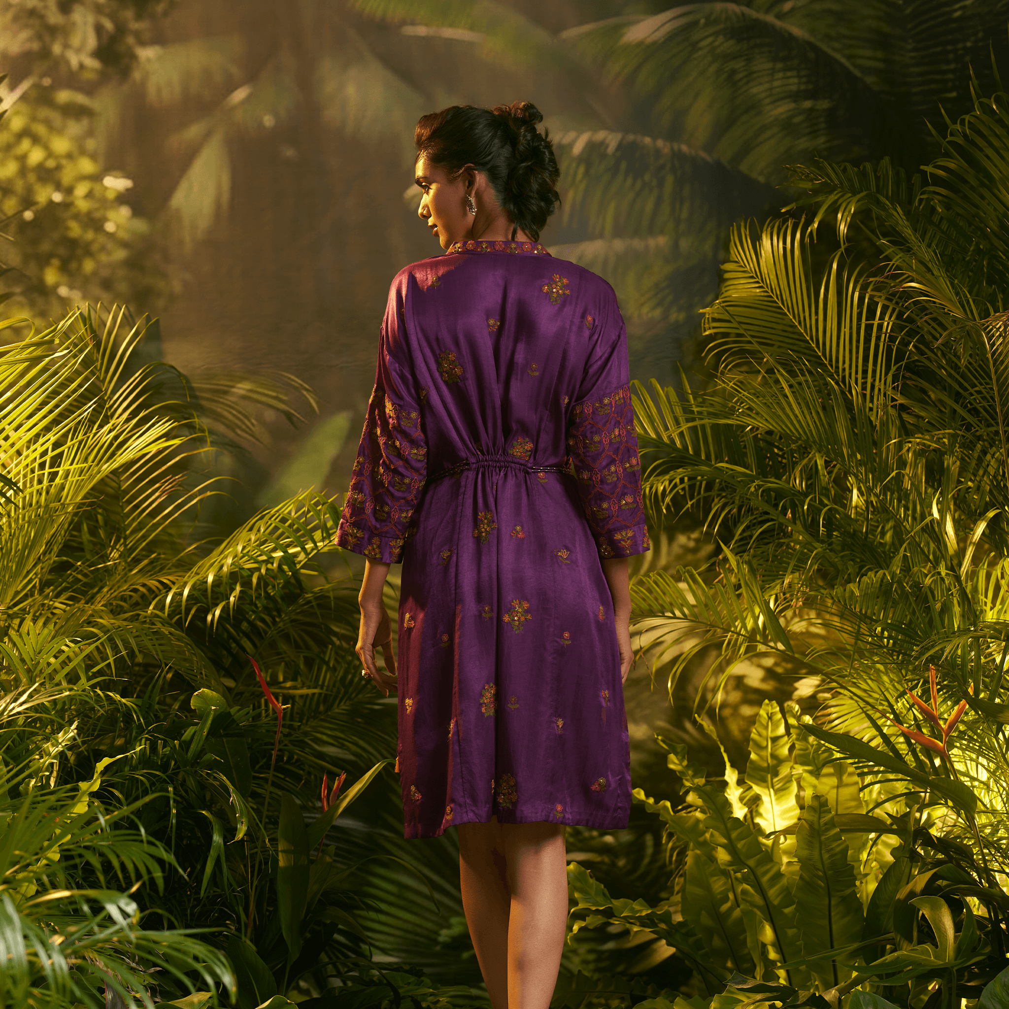 Elegant tropical designer dress Dubai in purple with intricate patterns, perfect for warm weather occasions